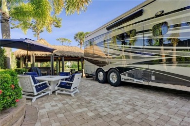Turnkey RV Lot with Premium Tiki and Lake Views! Enjoy on Motorcoach Resort Golf Course in Florida - for sale on GolfHomes.com, golf home, golf lot