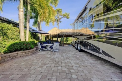 Turnkey RV Lot with Premium Tiki and Lake Views! Enjoy on Motorcoach Resort Golf Course in Florida - for sale on GolfHomes.com, golf home, golf lot