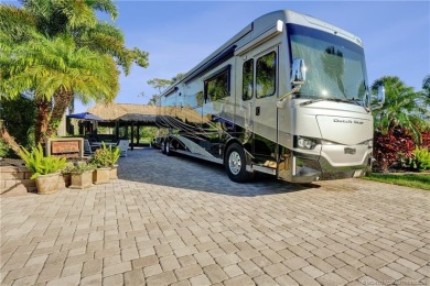 Turnkey RV Lot with Premium Tiki and Lake Views! Enjoy on Motorcoach Resort Golf Course in Florida - for sale on GolfHomes.com, golf home, golf lot
