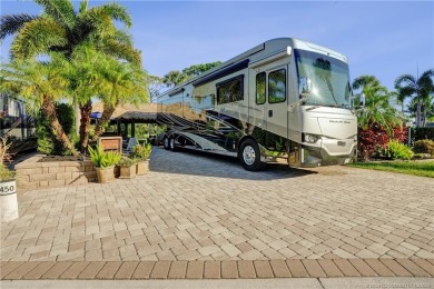 Turnkey RV Lot with Premium Tiki and Lake Views! Enjoy on Motorcoach Resort Golf Course in Florida - for sale on GolfHomes.com, golf home, golf lot