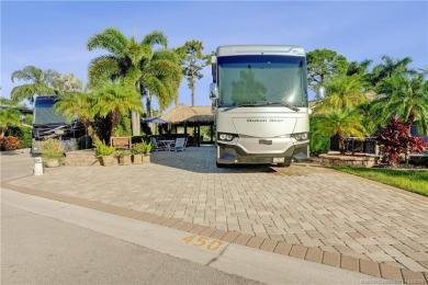 Turnkey RV Lot with Premium Tiki and Lake Views! Enjoy on Motorcoach Resort Golf Course in Florida - for sale on GolfHomes.com, golf home, golf lot