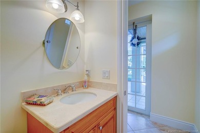 Luxury lakeside living awaits in this 5-bedroom, 3 full and 2 on Willoughby Golf Club in Florida - for sale on GolfHomes.com, golf home, golf lot