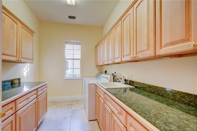 Luxury lakeside living awaits in this 5-bedroom, 3 full and 2 on Willoughby Golf Club in Florida - for sale on GolfHomes.com, golf home, golf lot