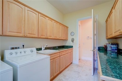 Luxury lakeside living awaits in this 5-bedroom, 3 full and 2 on Willoughby Golf Club in Florida - for sale on GolfHomes.com, golf home, golf lot