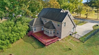 Discover the perfect mix of comfort, space, and country charm in on Fayetteville Country Club in Arkansas - for sale on GolfHomes.com, golf home, golf lot