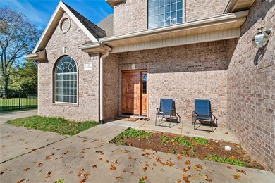 Discover the perfect mix of comfort, space, and country charm in on Fayetteville Country Club in Arkansas - for sale on GolfHomes.com, golf home, golf lot