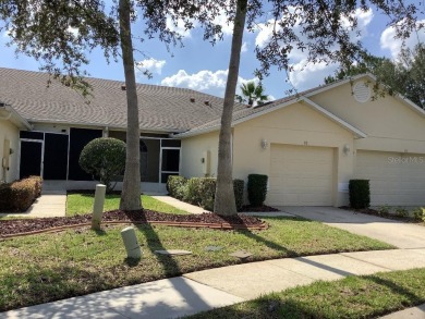 Charming two-bedroom, two-bath residence with a flex room on Remington Golf Club in Florida - for sale on GolfHomes.com, golf home, golf lot