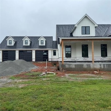 This newly constructed soon to be masterpiece was crafted with on The Coves Golf Course in Oklahoma - for sale on GolfHomes.com, golf home, golf lot