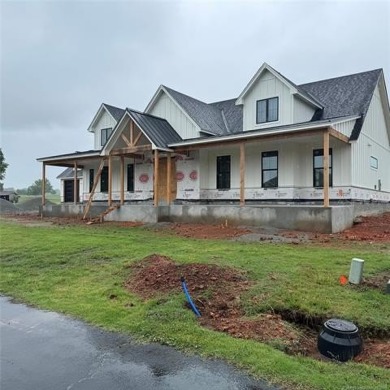 This newly constructed soon to be masterpiece was crafted with on The Coves Golf Course in Oklahoma - for sale on GolfHomes.com, golf home, golf lot