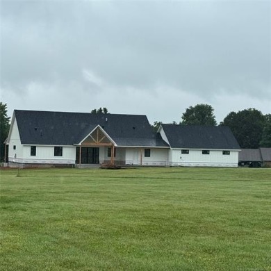 This newly constructed soon to be masterpiece was crafted with on The Coves Golf Course in Oklahoma - for sale on GolfHomes.com, golf home, golf lot