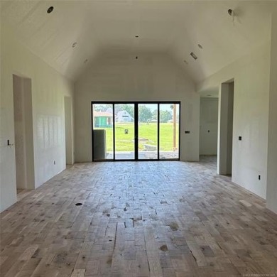 This newly constructed soon to be masterpiece was crafted with on The Coves Golf Course in Oklahoma - for sale on GolfHomes.com, golf home, golf lot