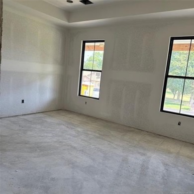 This newly constructed soon to be masterpiece was crafted with on The Coves Golf Course in Oklahoma - for sale on GolfHomes.com, golf home, golf lot