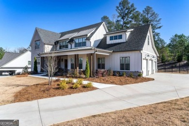 Welcome to this wonderfully modern farmhouse in the stunning on The Governors Towne Club in Georgia - for sale on GolfHomes.com, golf home, golf lot