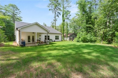 This lovely custom-built home offers a flowing, spacious on Fairfield Plantation Golf and Country Club in Georgia - for sale on GolfHomes.com, golf home, golf lot