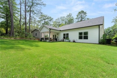 This lovely custom-built home offers a flowing, spacious on Fairfield Plantation Golf and Country Club in Georgia - for sale on GolfHomes.com, golf home, golf lot