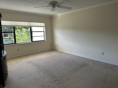 Welcome to this light and bright 2BR/2.5BA lakefront townhouse on Boca Lago Golf and Country Club in Florida - for sale on GolfHomes.com, golf home, golf lot