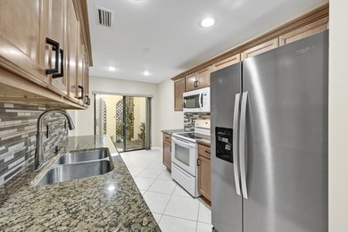 Welcome to this light and bright 2BR/2.5BA lakefront townhouse on Boca Lago Golf and Country Club in Florida - for sale on GolfHomes.com, golf home, golf lot