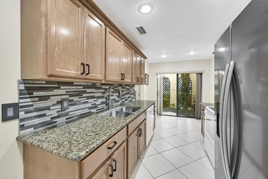 Welcome to this light and bright 2BR/2.5BA lakefront townhouse on Boca Lago Golf and Country Club in Florida - for sale on GolfHomes.com, golf home, golf lot