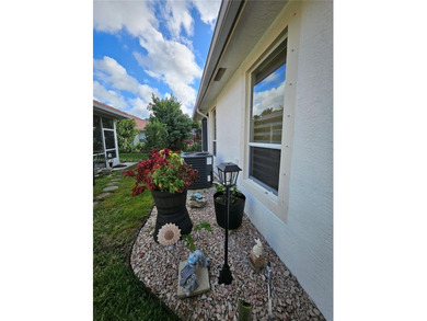 Lovely 3BR/2BA/2CG villa in the gated community of Summerfield on Champions Club at Summerfield in Florida - for sale on GolfHomes.com, golf home, golf lot