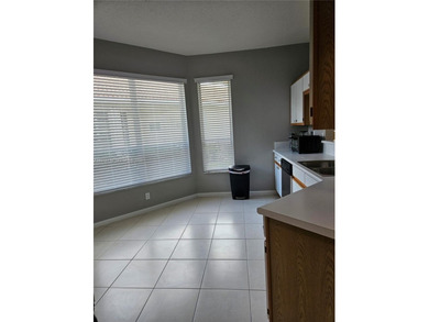 Lovely 3BR/2BA/2CG villa in the gated community of Summerfield on Champions Club at Summerfield in Florida - for sale on GolfHomes.com, golf home, golf lot