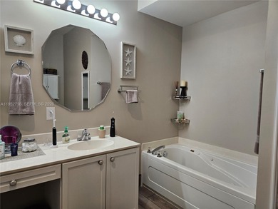 Lovely 3BR/2BA/2CG villa in the gated community of Summerfield on Champions Club at Summerfield in Florida - for sale on GolfHomes.com, golf home, golf lot