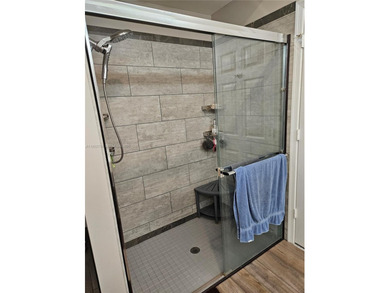 Lovely 3BR/2BA/2CG villa in the gated community of Summerfield on Champions Club at Summerfield in Florida - for sale on GolfHomes.com, golf home, golf lot