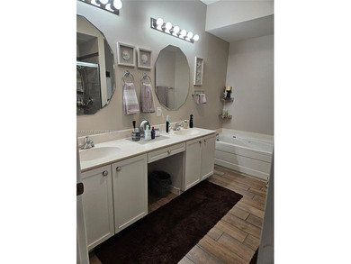 Lovely 3BR/2BA/2CG villa in the gated community of Summerfield on Champions Club at Summerfield in Florida - for sale on GolfHomes.com, golf home, golf lot