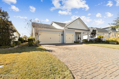 Live where every day feels like a getaway in this beautifully on Amelia National Golf and Country Club in Florida - for sale on GolfHomes.com, golf home, golf lot