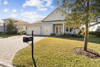 Live where every day feels like a getaway in this beautifully on Amelia National Golf and Country Club in Florida - for sale on GolfHomes.com, golf home, golf lot