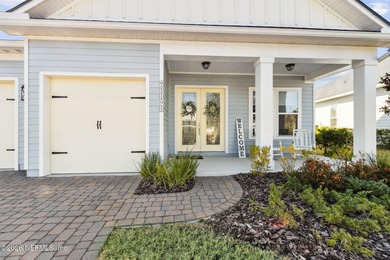 Live where every day feels like a getaway in this beautifully on Amelia National Golf and Country Club in Florida - for sale on GolfHomes.com, golf home, golf lot