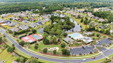 Discover the epitome of luxury living in this stunning end-unit on Lennon Hills Golf Course in North Carolina - for sale on GolfHomes.com, golf home, golf lot