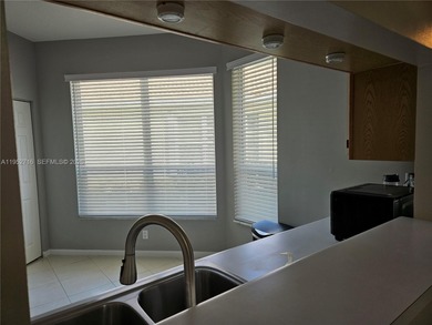 Lovely 3BR/2BA/2CG villa in the gated community of Summerfield on Champions Club at Summerfield in Florida - for sale on GolfHomes.com, golf home, golf lot