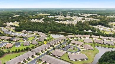 Discover the epitome of luxury living in this stunning end-unit on Lennon Hills Golf Course in North Carolina - for sale on GolfHomes.com, golf home, golf lot