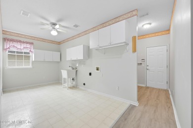 Located in the prestigious Community of Eagle Harbor in Fleming on Eagle Harbor Golf Club in Florida - for sale on GolfHomes.com, golf home, golf lot