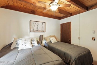 This beautifully maintained 3-bedroom, 2-bath chalet is tucked on The Hideout Golf in Pennsylvania - for sale on GolfHomes.com, golf home, golf lot
