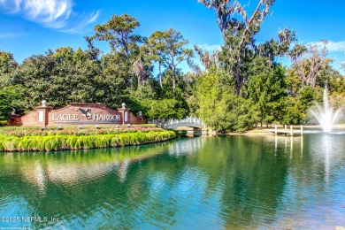 Located in the prestigious Community of Eagle Harbor in Fleming on Eagle Harbor Golf Club in Florida - for sale on GolfHomes.com, golf home, golf lot