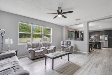 This beautifully updated 5-bedroom, 3-bath home is located in a on Wedgefield Golf Club in Florida - for sale on GolfHomes.com, golf home, golf lot