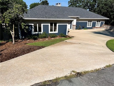 Experience resort-style living with this exceptional lakefront on Bella Vista Country Club - Berksdale in Arkansas - for sale on GolfHomes.com, golf home, golf lot