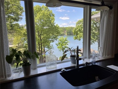 Experience resort-style living with this exceptional lakefront on Bella Vista Country Club - Berksdale in Arkansas - for sale on GolfHomes.com, golf home, golf lot