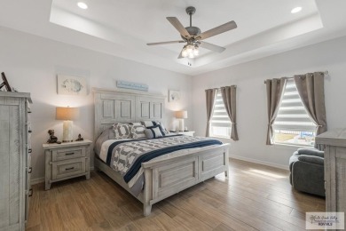 Discover this beautiful 3-bedroom, 2-bathroom lakeside home in on South Padre Island Golf Club in Texas - for sale on GolfHomes.com, golf home, golf lot