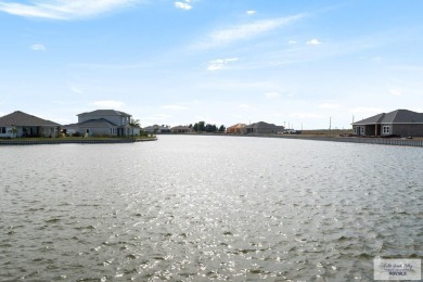 Discover this beautiful 3-bedroom, 2-bathroom lakeside home in on South Padre Island Golf Club in Texas - for sale on GolfHomes.com, golf home, golf lot