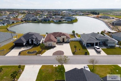 Discover this beautiful 3-bedroom, 2-bathroom lakeside home in on South Padre Island Golf Club in Texas - for sale on GolfHomes.com, golf home, golf lot