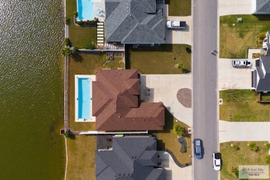 Discover this beautiful 3-bedroom, 2-bathroom lakeside home in on South Padre Island Golf Club in Texas - for sale on GolfHomes.com, golf home, golf lot