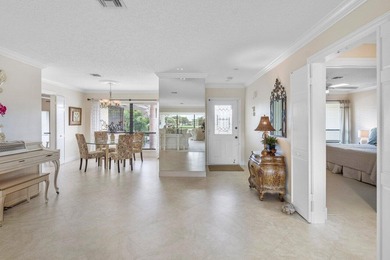 Enjoy gorgeous golf course and lake views from this stunning on Quail Ridge Golf Course and Country Club in Florida - for sale on GolfHomes.com, golf home, golf lot