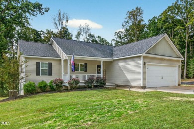 This better than new custom built 2021 home offers an open floor on River Golf and Country Club at Lake Royale in North Carolina - for sale on GolfHomes.com, golf home, golf lot