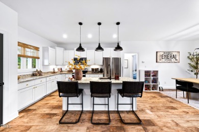 This better than new custom built 2021 home offers an open floor on River Golf and Country Club at Lake Royale in North Carolina - for sale on GolfHomes.com, golf home, golf lot