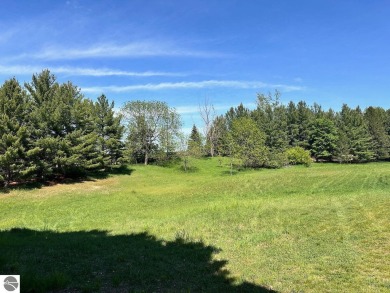 Beautiful, and lightly treed, lot overlooking the 4th fairway at on Shanty Creek Golf Course in Michigan - for sale on GolfHomes.com, golf home, golf lot