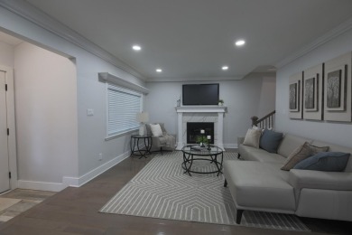 This cottage style bungalow surrounded by a white picket fence on Evergreen Hills Golf Course in Michigan - for sale on GolfHomes.com, golf home, golf lot