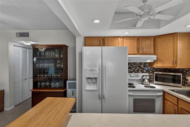 Welcome to this beautifully updated 1-bedroom, 1.5-bath on Hillsboro Pines Golf in Florida - for sale on GolfHomes.com, golf home, golf lot