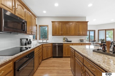 Luxury meets comfort in this stunning custom brick ranch backing on Tiburon Golf Club in Nebraska - for sale on GolfHomes.com, golf home, golf lot